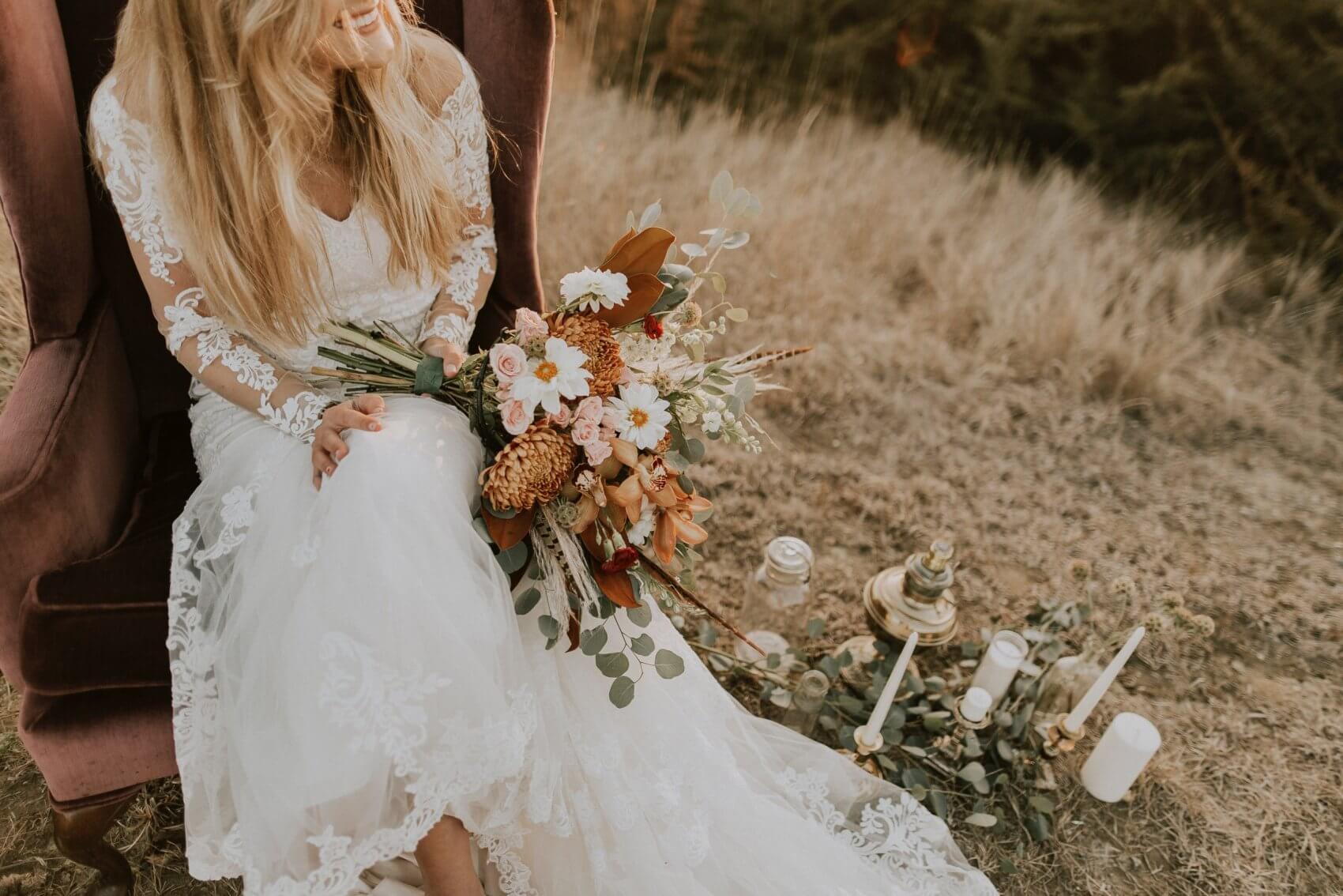 Women in Wedding Dress Holding Flowers